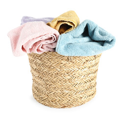 Laundry basket full of towels isolated on white