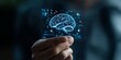 © Odin AI - A hand holds a digital holographic brain, representing the tangible interface of artificial intelligence and cognitive technology in modern times.