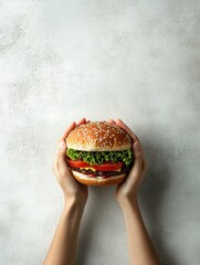 Poster - Two hands firmly grip a big burger, showcasing vibrant layers of lettuce, tomato, and other delicious fillings against a light backdrop. Generative AI