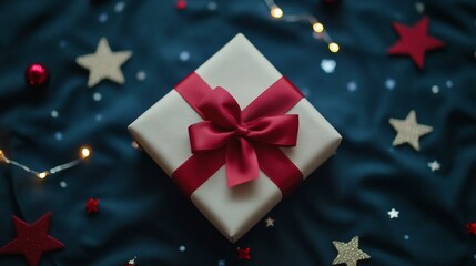 Wall Mural - White gift box with red bow, surrounded by stars, perfect for holiday celebrations or special occasions.