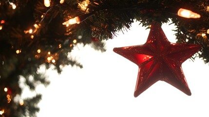 Wall Mural - Red star ornament hanging from Christmas tree with green branches, festive decoration for holiday season.