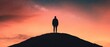 © Dirty Pure - Silhouette of a Man Standing on a Hilltop Against a Starry Sky at Sunset