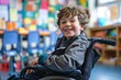 © Boomanoid - Young boy in wheelchair smiling in classroom