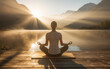 © Chineewan Somsap - serene photograph of person meditating by tranquil lake at sunrise, surrounded by mountains and soft mist. warm sunlight creates peaceful atmosphere