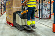© unai - Part of worker using forklift in a warehouse