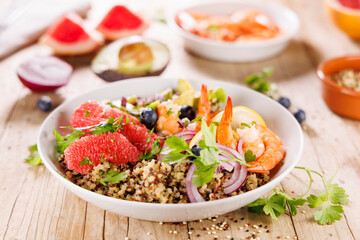 Wall Mural - quinoa salad with grapefruit, avocado and shrimp. vegetarian Buddha bowl, healthy eating