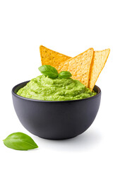 Bowl of guacamole with tortilla chips, isolated on white background