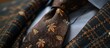 © Waraporn - Close up of an elegant silk necktie featuring a sophisticated intricately woven floral pattern in warm autumn tones of brown and orange  The tie is a classic formal accessory for a professional