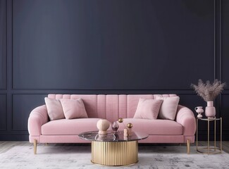 A pink velvet sofa sits in front of a dark blue wall with decorative molding and two hanging lights A glass coffee table with a silver tray sits in front of the sofa and a potted plant is on the right