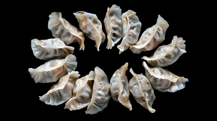 overhead view of Baozi ,asian dumplings, dim sum, ravioli, buuz, pelmeni, pyanse, khinkali or manti isolated on black background, concept for cooking