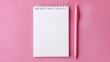 © DuangphonKPR - A blank notepad and pink pen on a pink background, perfect for notes, doodles, or creative ideas.