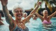 © Khmel - Active seniors enjoying a water aerobics class in a sunny pool