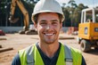 © ThomasLENNE - Close portrait of a smiling young Australian man construction worker looking at the camera, Australian outdoors construction site blurred background