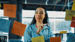 © Summit Art Creations - Portrait of skilled young beautiful hispanic project manager thinking about marketing idea. Professional businesswoman making business plan by using sticky notes at glass board in office. Manipulator.