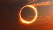 © sobartea - A ring of fire solar eclipse in the sky with clouds.