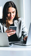 © lina - woman multitasking with a phone laptop