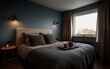 © Who is Santi - A serene and inviting bedroom showcasing gray-blue walls, a plush bed with a dark gray blanket, and a wooden floor.