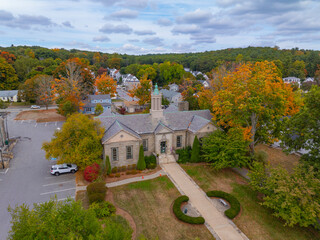 Whitinsville Social Library aerial view at 17 Church Street in fall with foliage in historic village of Whitinsville, town of Northbridge, Massachusetts MA, USA. 