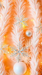 Wall Mural - silver snowflake ornament hanging on a peach-colored artificial tree