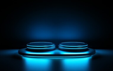 A futuristic display platform with two circular elements illuminated in blue light against a dark background.