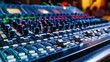 © Justlight - A large mixer with multiple s and buttons used for adjusting audio levels.