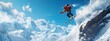 © Pierre - A skier in mid-air, leaping off an icy cliff with snow-covered mountains and blue sky behind them