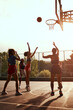 © peopleimages.com - Basketball, women and shooting for score, competition and sports training with practice on court. Fitness, people and athlete for exercise, workout and community game with play, teamwork and outdoor