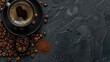 © Lasvu - Top view of black coffee cup, beans, and grounds on background with space for text