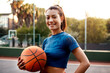 © peopleimages.com - Woman, portrait and basketball for fitness, cardio and outdoor exercise or hobby on court. Confident athlete, person and game for goals, sport workout or summer match for endurance or health training