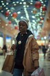 © Alla - A woman holding multiple shopping bags in a busy mall setting