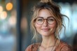 © Vesna - enthusiastic businesswoman with glasses laughing joyfully in a modern office space while contemplating new opportunities embodying positivity and success