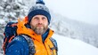 © serdon - Close-up of a man with a snow-covered beard and hat, winter chill concept