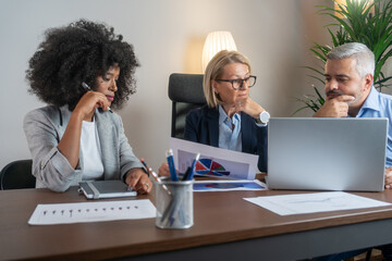 Business people discussing in a meeting. Business people negotiating at boardroom behind closed doors. Confident creative business people meeting at office.