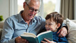 © Olga Ко - grandfather and grandson reading a book photo