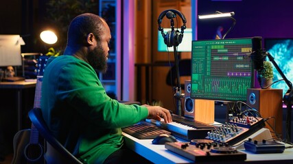 Leinwandbilder - Artist playing electronic piano keyboard notes and recording audio files to use mix and master techniques, editing recordings to edit sound effects. Musician operating on synthesizer gear. Camera A.