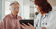 © peopleimages.com - Advice, old woman and doctor with tablet for results, consultation or healthcare discussion in office. Help, senior patient and medical professional on digital app for health, wellness and good news