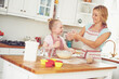 © peopleimages.com - Smile, child and mom in kitchen baking with teaching, learning and morning bonding together for lunch. Love, mother and daughter with help, ingredients and recipe for breakfast cupcake with kid baker