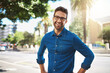 © peopleimages.com - City, confidence and man in portrait for vacation, travel holiday and adventure with smile in summer. Happy, male person and traveler with laugh for weekend journey, glasses and pride in California