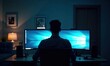 © Ruslan Gilmanshin - A man is sitting in front of two computer monitors illuminated by dim light in a darkened room filled with shadows around him