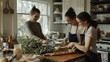 © VK Studio - Three friends joyfully engage in a cooking session, preparing food with a bounty of fresh ingredients in a sunlit kitchen.