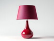 © imam - A red table lamp with a shade isolated