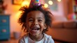 © SerPak - A smiling child with curly hair wears a vibrant party hat, radiating joy during a birthday celebration. The cozy indoor setting features warm lighting and festive decorations, enhancing the cheerful a