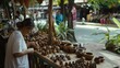 © VK Studio - An artisan carefully examines handmade wooden crafts in an outdoor market stall, surrounded by an array of unique, rustic items under dappled sunlight.