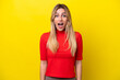 © luismolinero - Young Uruguayan woman isolated on yellow background with surprise facial expression