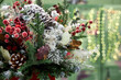 © Vieille Prune - Christmas bouquet of pine needles with cones on green background with bokeh