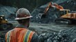 © VK Studio - A construction worker in a reflective vest observes earth-moving machinery, symbolizing the grit of quarry operations.