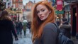 © Postmodern Studio - A woman with red hair and freckles walks down a city street