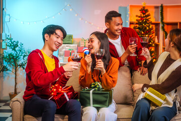 Lively Friday night New Year party with Asian friends, middle-aged and young adults, celebrating with champagne, wine, gifts, and food. A cozy, festive indoor gathering filled with joy and cheer.