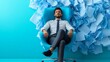 © Trusha - Man is sitting in a chair with papers all around him. The chair is blue and the man is wearing a tie. Concept of relaxation and leisure