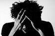 © Rosnani - A person expressing distress with hands on their head.
